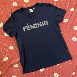 Woman's Small Little Moon top. The front says Feminin in white beads.